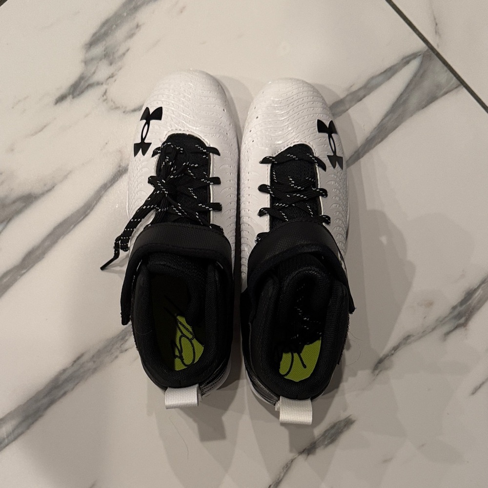 Under Armour Kids' White and Black spikes